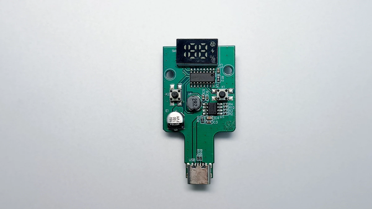 Portable fan prototype PCB with a digital display, control buttons and USB-C charging port.